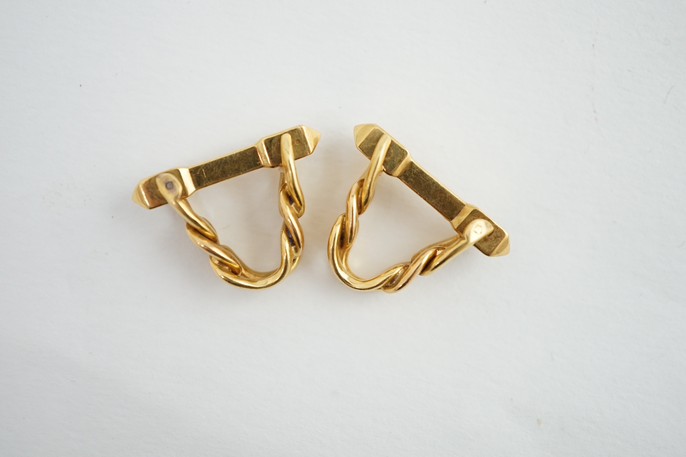 A pair of 18K yellow gold stirrup cufflinks, by Boucheron